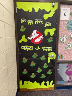 a classroom door decorated with halloween decorations