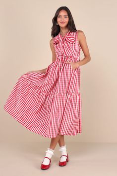 From ballet flats to cowboy boots, the Sister Jane Stables Red and White Gingham Tiered Midi Dress With Pockets is ready to be styled to perfection! A classic red gingham print adorns slightly shimmery, lightweight woven fabric as it shapes this darling dress. A ruffled, mock neckline (with a notched detail) boasts sash ties that create a bow at the center of the sleeveless bodice. High waist features curved seaming atop a tiered, A-line skirt with side seam pockets and a chic midi hem. Fit: Thi Kentucky Derby Dress, Red And White Gingham, Midi Dress With Pockets, Red And White Dress, Sister Jane, Derby Dress, Eve Dresses, Darling Dress, Red Gingham