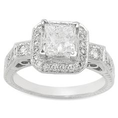 an engagement ring with a princess cut diamond in the center and pave set shoulders