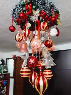 a chandelier with ornaments hanging from it