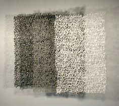 an abstract piece of art that looks like it has been made with black and white paint