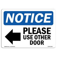 a blue and white sign with an arrow pointing to the right that says notice please use other door