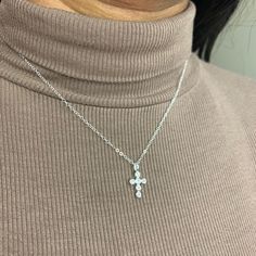 "This beautiful dainty sterling silver cross necklace is  on a sterling silver chain, with Cubic Zirconia stones on the cross.  This beautiful piece is perfect for any occasion and also makes a great gift. This piece is perfect by itself or for layering with other pieces.  Description: Material: Sterling Silver Pendant Size: 17.5mm x 9.4mm All components are made of Sterling Silver Pictured is necklace in 16\" length. See similar items below: https://www.etsy.com/ca/shop/MylasShoppe?ref=seller-platform-mcnav&section_id=28089262 For shipping details / gift box option, please see FAQs section or feel free to contact me with any questions :) Thank you for visiting!" Sterling Silver Cross Necklace With Clavicle Chain, Sterling Silver Crucifix Cross Necklace With Adjustable Chain, Sterling Silver Cross Charm Necklace With Adjustable Chain, Dainty Cubic Zirconia Cross Necklace, Dainty Cross Necklace In Cubic Zirconia, Sterling Silver Hypoallergenic Cross Pendant Necklace, Silver Hypoallergenic Cross Necklace, Silver Hypoallergenic Cross Pendant Necklace, Hypoallergenic Sterling Silver Cross Pendant Necklace