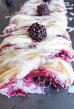 a close up of a pastry with berries on it