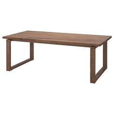 a wooden table sitting on top of a white floor