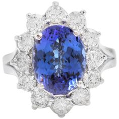 5.90 Carats Natural Very Nice Looking Tanzanite and Diamond 14K Solid White Gold Ring Total Natural Oval Cut Tanzanite Weight is: 4.00 Carats Natural Round Diamonds Weight: 1.90 Carats (color G-H / Clarity SI1-SI2) Ring size: 5.5 (we offer free re-sizing upon request) Ring total weight: 7.0 grams Disclaimer: all weights, measurements and colors are approximate and may vary slightly from the listed dimensions or as seen in the image. All pictures are magnified to show the smallest of details. Please, refer to the item description for actual weight and size evaluation. SKU #1207 Tanzanite Stone, Etsy Gold Ring, Tanzanite Ring, Blue Sapphire Diamond, Natural Tanzanite, Natural Blue Sapphire, White Gold Ring, Sapphire Diamond, Quality Diamonds