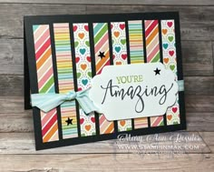 a handmade card that says you're amazing with colorful stripes and hearts on it