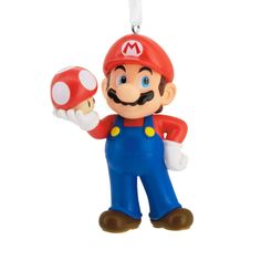 an ornament shaped like mario is holding a mushroom