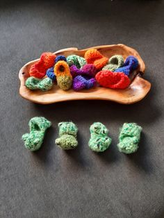 small crocheted objects on a wooden tray