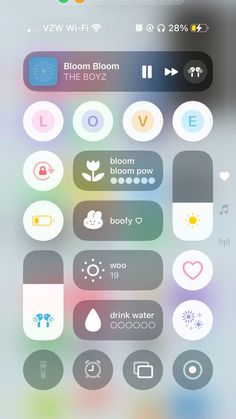 an iphone screen with various icons and buttons on the bottom left corner, including two different colors