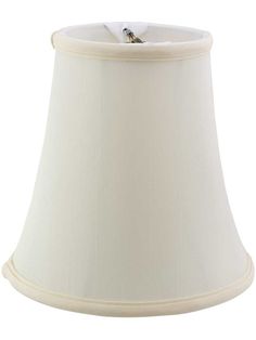 a white lamp shade with a small bird on the bottom and a light bulb attached to it