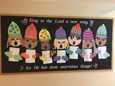 a bulletin board with children's paper hats on it and the words sing to the lord a new song for he has done marvelous things