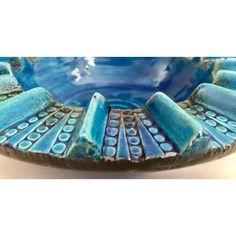 a blue bowl with an intricate design on it