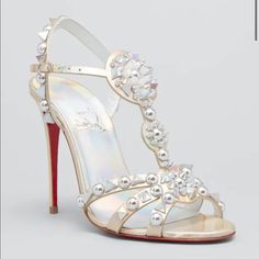 New In Box. Never Worn. Pristine Condition Size 36 Christian Louboutin Sandals In Studded Iridescent Calf Leather 4.00 In / 100 Mm Stiletto Heel Peep Toe T-Strap Vamp Adjustable Ankle Strap Signature Louboutin Red Leather Outsole Made In Italy Designer White Wedding Shoes, Louboutin Sandals, Christian Louboutin Sandals, Designer Wedding Shoes, Red Louboutin, Red Sole, Hot Shoes, Louboutin Shoes, T Strap