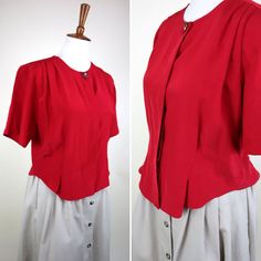 "This lovely 90's blouse from Bently is fitted at the waist, with darts at ribs and back, a hidden button line, and a cute ornate button at the crew collar. It is a perfect addition to a work appropriate wardrobe, but it has so many stylistic elements that it would look good for the Aesthetic too.  GARMENT MEASUREMENTS (in Inches) Bust:38\" Waist:35\" Hemline:34\" Sleeve Length:17\" Length:21.5\" BEST FITS: Size Medium **all Measurements are taken with the garment lying flat, then doubled. Be sure to leave room for movement and comfort** CONDITION: VINTAGE GOOD: Good condition, some visible wear but no serious flaws to make note of. LABEL: Bently MATERIALS: feels like polyester SIZE LABEL: none *please note that vintage size labels vary wildly and refer to the size chart and garment measur Vintage V-neck Tops For Workwear, Classic Fitted Red Blouse, Classic Red Fitted Blouse, Retro Red Formal Tops, Red Retro Formal Tops, Red Buttoned Tops For Daywear, Vintage Red Blouse For Daywear, Vintage Red Top For Formal Occasions, Red Button Tops For Daywear