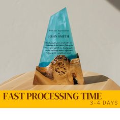 an award for fast processing time is displayed on a wooden table with the words fast processing time