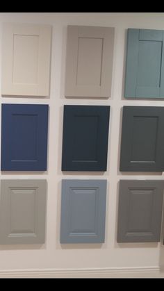 a wall with many different colors of doors on it's sides and the floor