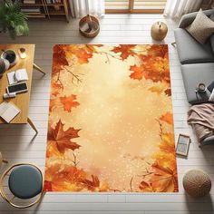 an overhead view of a living room area rug with autumn leaves on it