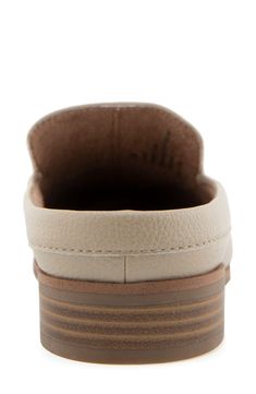 An almond-shaped moc toe adds classic polish to a loafer-inspired mule with a shock-absorbing sole. Synthetic upper, lining and sole Imported Classic Slip-on Clogs With Textured Sole, Workwear Clogs With Textured Sole And Round Toe, Beige Round Toe Mules With Textured Sole, Beige Textured Sole Round Toe Mules, Classic Beige Leather Clogs, Classic Beige Clogs With Rubber Sole, Classic Round Toe Synthetic Mules, Beige Synthetic Mules With Rubber Sole, Classic Beige Mules With Rubber Sole