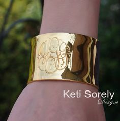 Personalized monogram bangle with hand engraved initials. Very stylish, unique gift for any women. Order in Sterling Silver, yellow gold or rose gold. Create elegant gift for woman of any age. Designs by: Keti Sorely. Metal options: - Sterling Silver - Sterling Silver with yellow gold overlay - Sterling Silver with Rose gold overlay Bracelet Width - 1.5" Engrave 1 to 3 initials. Bangle size: medium to large. One size fits all. ---------NOTE-------------- Traditional monograms are made with the f Luxury Cuff Bracelet Bangle For Anniversary, Luxury Cuff Bangle Bracelet For Anniversary, Luxury Bangle Cuff Bracelet For Anniversary, Luxury Gold Cuff Bracelet For Wedding, Gold Cuff Jewelry With Polished Finish, Luxury Rose Gold Bangle Cuff Bracelet, Luxury Engraved Yellow Gold Cuff Bracelet, Luxury Cuff Bracelets For Anniversary, Luxury Gold Bangle For Anniversary