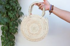 Lightweight Bag. Large Bag. Hand died palm leaf. Round Handel. Beach Bag. TASSEL SOLD SEPARATELY Diameter- 10 inches Height including handals- 15 inches Bohemian Straw Bag For Vacation, Bohemian Spring Handwoven Straw Bag, Spring Bohemian Handwoven Straw Bag, Bohemian Straw Bag With Braided Handles For Festival, Bohemian Natural Straw Bag For Spring, Natural Bohemian Straw Bag For Spring, White Woven Bohemian Straw Bag, Bohemian Fair Trade Straw Bag For Beach, Handmade Summer Straw Bag For Festival