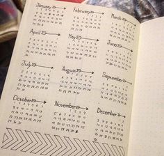 an open notebook with calendars on the pages and numbers in each page, as well as arrows