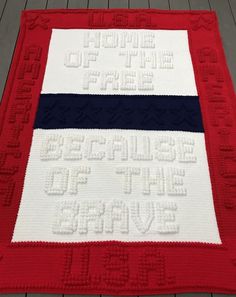 a red, white and blue blanket with words on it