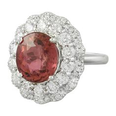 Stamped: 14K Total Ring Weight: 7.9 Grams Tourmaline Weight 5.30 Carat (11.00x9.80 Millimeters)Diamond Weight: 1.50 carat (F-G Color, VS2-SI1 Clarity )Face Measures: 20.40x17.90 Millimeter SKU: [601191] Gia Certified Tourmaline Rings For Formal Occasions, Luxury Tourmaline Rings With Halo Setting, Fine Jewelry Tourmaline Rings With Brilliant Cut, Elegant Oval Tourmaline Gemstones, Elegant Tourmaline Gemstone With Center Stone, Oval Tourmaline White Gold Rings, Gia Certified Tourmaline Wedding Ring, Luxury Oval Tourmaline Ring, Wedding Gia Certified Tourmaline Ring