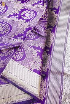 purple and white banaram saree with intricate design on the palan border