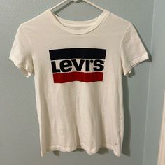 Vintage Levi's Logo T-Shirt Size : Small *Never Worn Make Best Offer! Levi's Logo Print Tops For Summer, Levi's Casual Tops With Letter Print, Casual Levi's Tops With Letter Print, Trendy Levi's Graphic Print Tops, Levi's Graphic Tee Tops For Summer, Levi's Casual Letter Print Tops, Levi's Short Sleeve Tops With Letter Print, Levi's Graphic Tee For Summer, Levi's Graphic Tee With Crew Neck