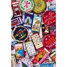 some very pretty decorated cookies on a white table cloth with words and pictures around them