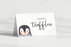 a card with a penguin on it that says snowball truffles