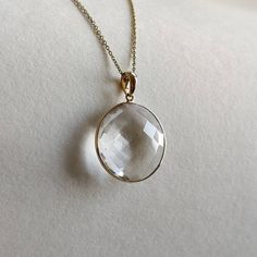 ITEM DESCRIPTION: >>The pendant is made from Solid 14K Yellow Gold. Gemstone used is absolutely natural and ethically sourced. >>Natural Clear quartz briolette in Round shape and bezel setting is studded on it with utmost precision. >>This is a minimalist design and is absolutely hassle-free and everyday jewelry. Gem: Clear quartz Gem size: 20 mm, round Gem weight: 14.58carats Gold purity: 14K (58.33% approx.) Gold weight: 0.61 grams Gross weight: 3.53 grams The Gold purity is guaranteed and it Refined 14k Gold Jewelry With Vs Clarity, Timeless Faceted Yellow Gold Jewelry, Yellow Gold Briolette Gemstones For Formal Occasions, Formal Yellow Gold Briolette Gemstones, Elegant Drop Gemstone, Round Gold Gemstones Fine Jewelry, Timeless Faceted Jewelry For Gift, Faceted Yellow Gold Pendant Jewelry, Fine Jewelry Briolette Gemstones For Formal Occasions