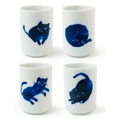 four white cups with blue cats painted on them