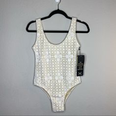 Nightcap Lace Swimsuit, Size Medium. New With Tags, No Liner. Beautiful White Floral Crochet Lace Swimsuit, Fully Lined. Scoop Neckline, Low Back, And Cheeky Bottom Coverage. Super Flirty And Beautiful Swimsuit. Perfect Bachelorette/Honeymoon Suit. Lace Bodysuit With Lined Body For Summer, Cream Bodysuit For Beach And Spring, Cream Bodysuit For Spring Beach Occasions, Spring Beach Bodysuit In Cream, Summer Lace Bodysuit With Lined Body, Fitted White Lace Swimwear, Spring White Lace Bodysuit, Fitted Lace White Swimwear, Spring White Bodysuit With Lace Trim