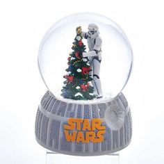 a snow globe with a star wars scene on it and a christmas tree in the middle