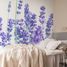 a bedroom with lavender flowers painted on the wall