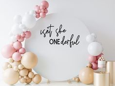 balloons and confetti are arranged around a sign that says just she one beautiful