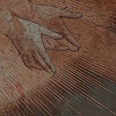 a drawing of a hand on the ground in front of a person's foot