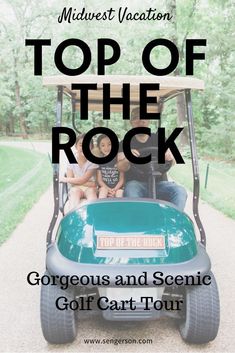 two people sitting in a golf cart with the words top of the rock on it