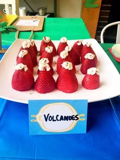 strawberries are arranged on a plate at a party