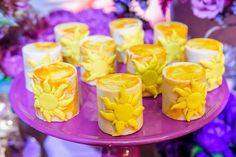 there are many candles that have yellow flowers on them