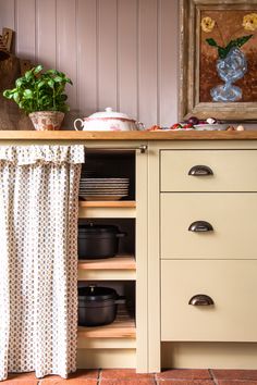 an old kitchen with pots and pans on the counter