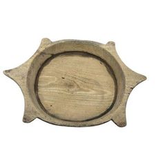 a wooden tray with an oval design on the front and bottom, made out of wood