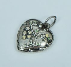 Vintage sterling silver and enamel puffy heart charm  Measures 5/8 inches wide by just under 3/4 inches tall  Significant loss to the enamel  Please ask any questions, always open to offers, and free shipping anywhere in the USA! Silver Enamel Heart Charm Jewelry, Heart-shaped Silver Enamel Jewelry, Silver Heart-shaped Enamel Jewelry, Silver Enamel Jewelry With Heart Charm, Burning Desire, Puffy Heart Charms, Puffy Heart, Charm Bracelets, Vintage Sterling Silver