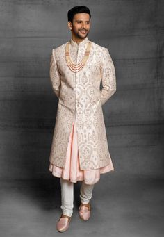 a man in a white and pink sherwa