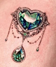 a woman's chest with a heart shaped piece of jewelry attached to the side