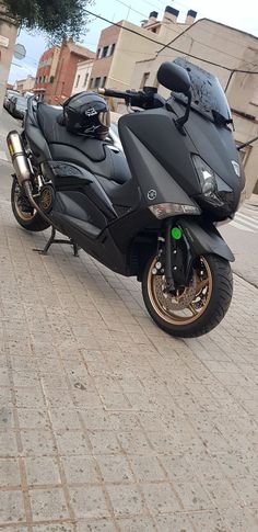 the motorcycle is parked on the side of the road