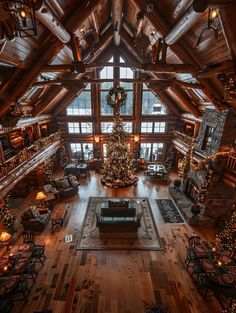 a large living room filled with furniture and a christmas tree in the middle of it