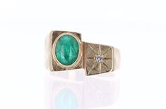 Signet rings are very prominent in politics as masculine rings, throughout history. This 14k gold signet ring will add lots of character to your daily look, emphasizing your edgier side. A natural emerald cabochon is bezel set and has excellent gemstone qualities. This special piece is also adorned with a star setting shining genuine white diamond on top. A more than perfect gift! Setting Style: Bezel Setting Material: 14K Yellow Gold Gold Weight: 10 Grams Main Stone: Emerald Cabochon Shape: Ova Luxury Oval Cabochon Men's Ring For Gift, Masculine Rings, Mens Gold Ring, 14k Gold Signet Ring, Star Setting, Emerald Cabochon, Mens Gold Rings, Signet Rings, Ring Mens